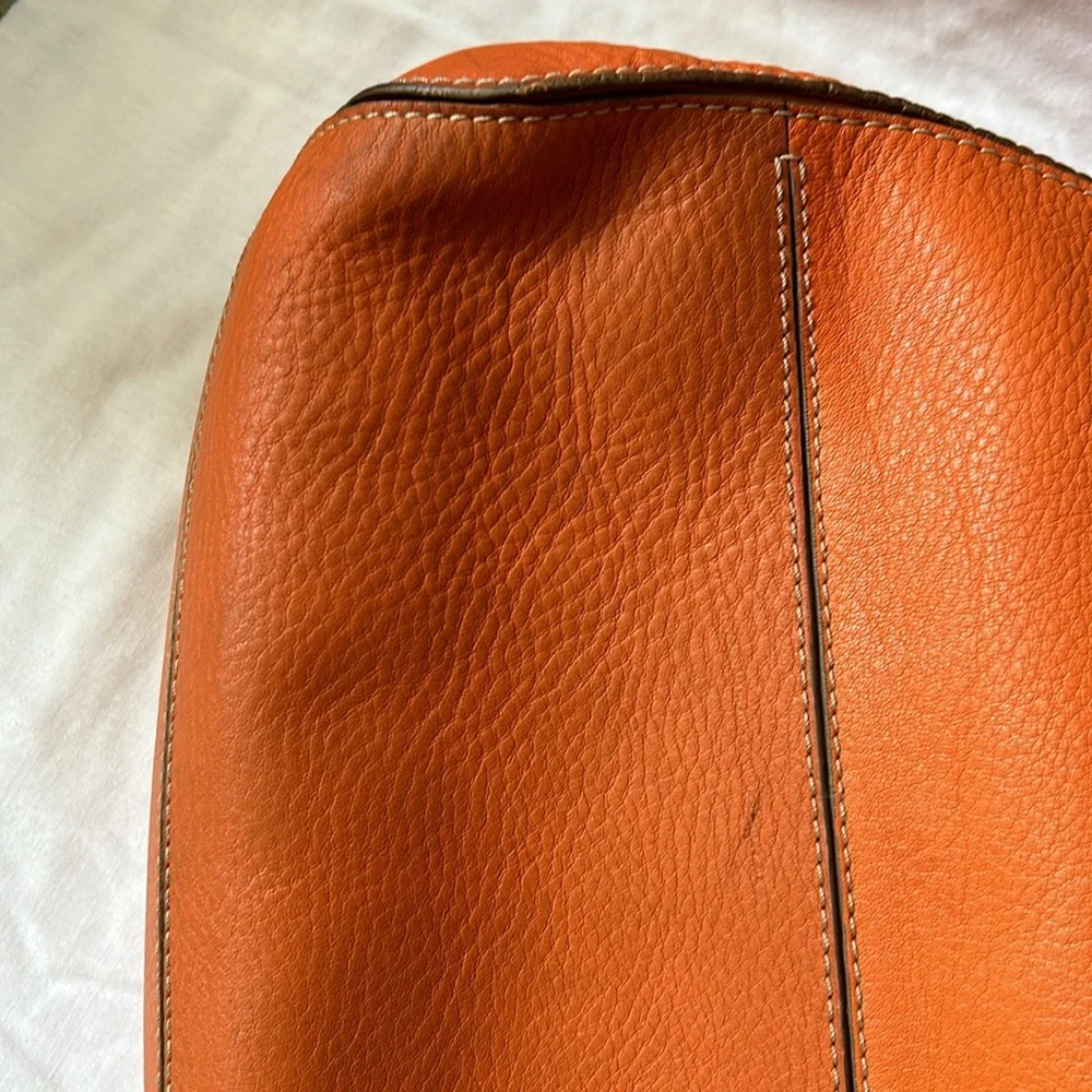 Large leather Cole Haan orange shoulder bag with silver hardware buckles. - Picture 6 of 16